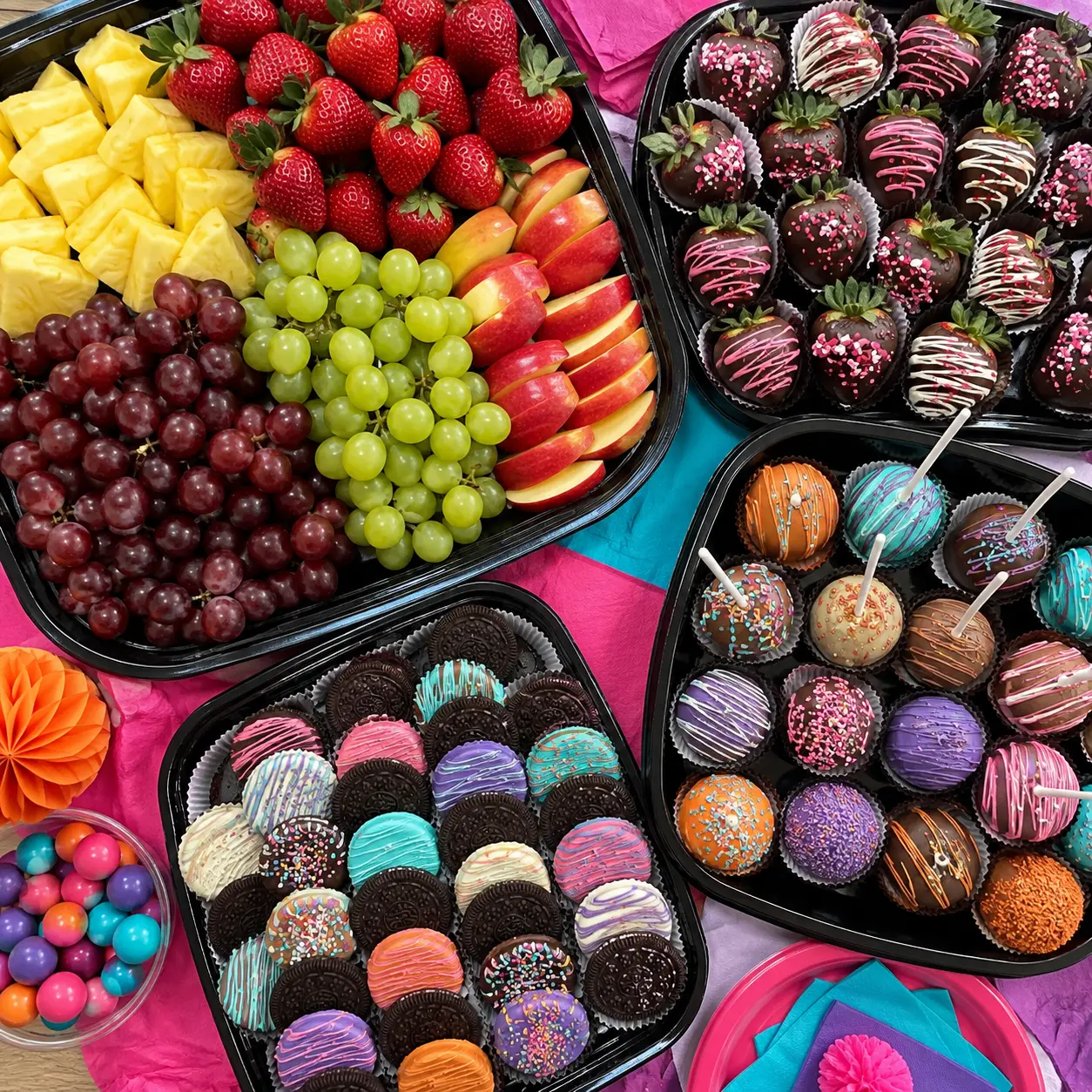 Vibrant fruit and dessert trays